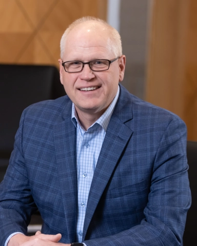 portrait of a smiling person in professional attire